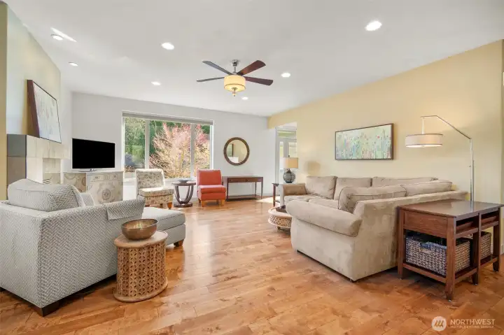 Comfortable living space centered around the fireplace with views to the outdoors.