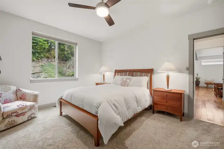 Primary bedroom on main floor, positioned for privacy, overlooking the back garden.