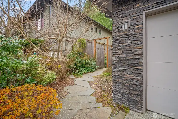 Pathway to private backyard garden retreat.