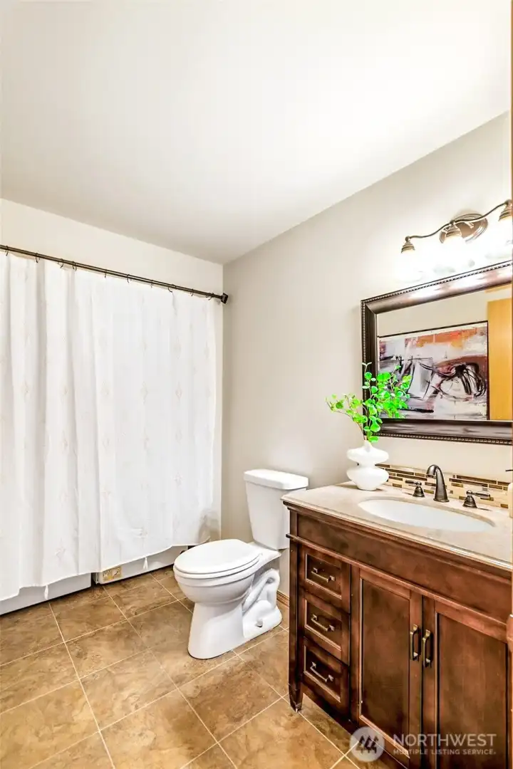 Main level powder room with laundry closet.