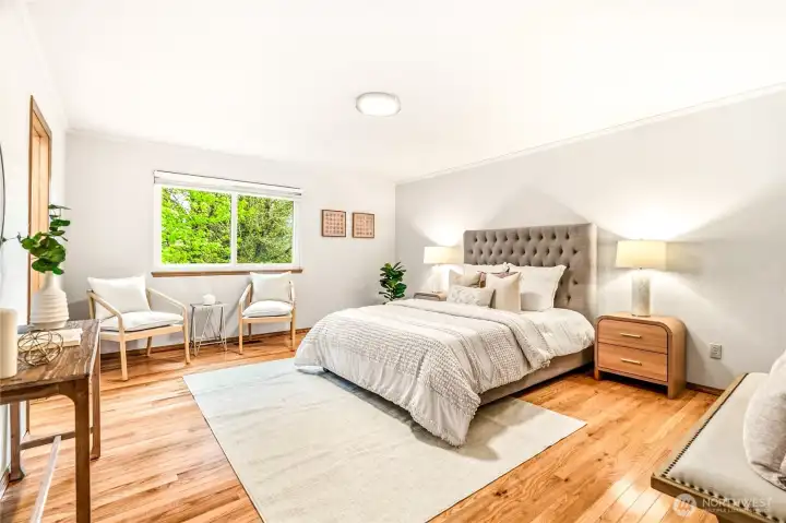 Primary bedroom with sitting area.