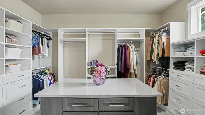 Second master closet features a built-in storage island