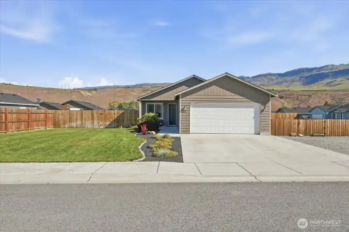 117 Island Loop Rd.  Corner lot with fenced yard and attractive landscaping.  Lots of extra parking and room for boat or RV.