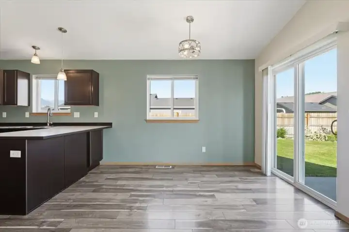 Dining area with slider to generouis size patio and fenced back yard.