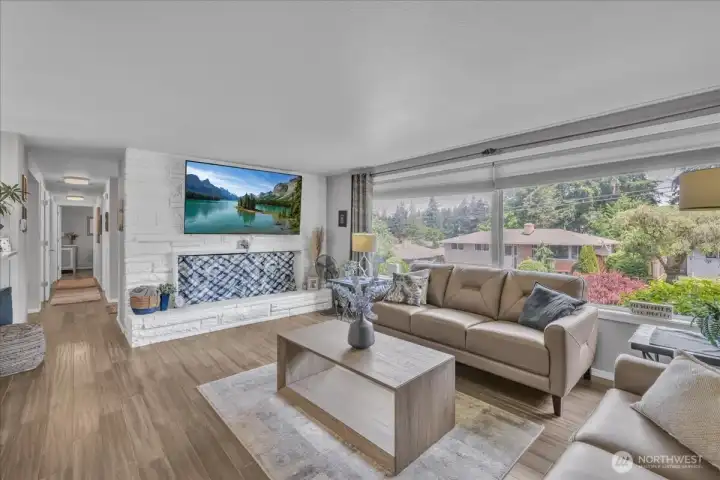 Large living room with windows for lots of natural light.