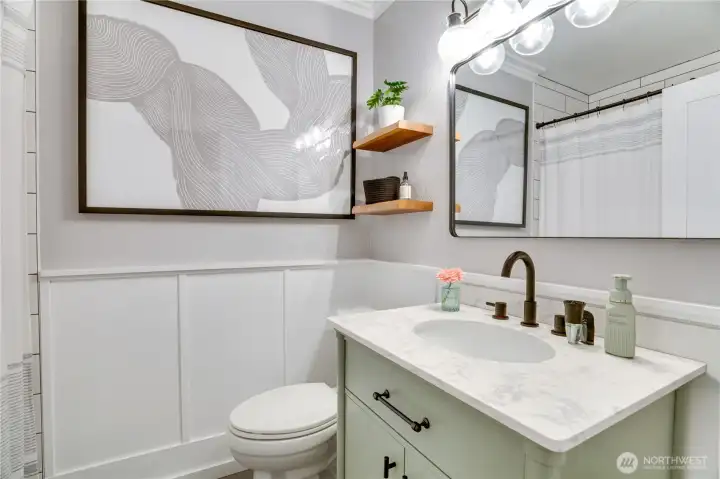 Guest bathroom, newly updated on the main floor. Shower is surround tile