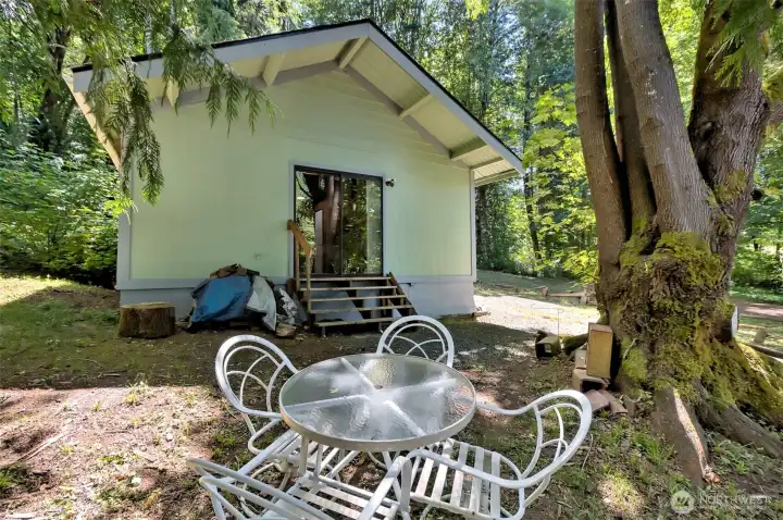 Cool space beside the house, where you can hear the babbling Coffee Creek nearby.