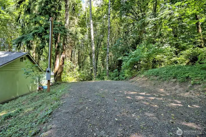 This is the flat spot above the house that has water and ties into the septic system. Great rental opportunity!