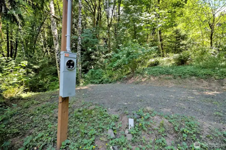 RV spot with water and ties into the septic system.
