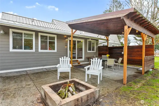 Owners built the gazebo to provide the shade from the afternoon sun, making it a great spot to BBQ, host & entertain friends & family. The laundry room is on the side of the sliding glass door.