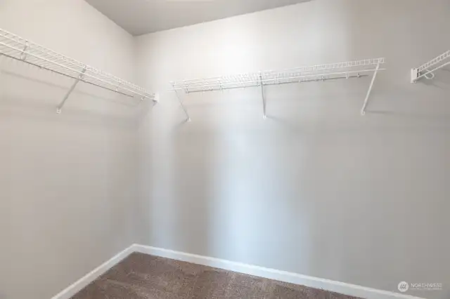 So much space in this huge primary walk-in-closet!