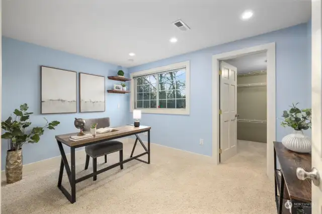 On the second floor, a bedroom with a large walk in closet.