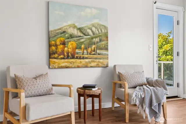Gracious Primary features sitting area, opens to private deck
