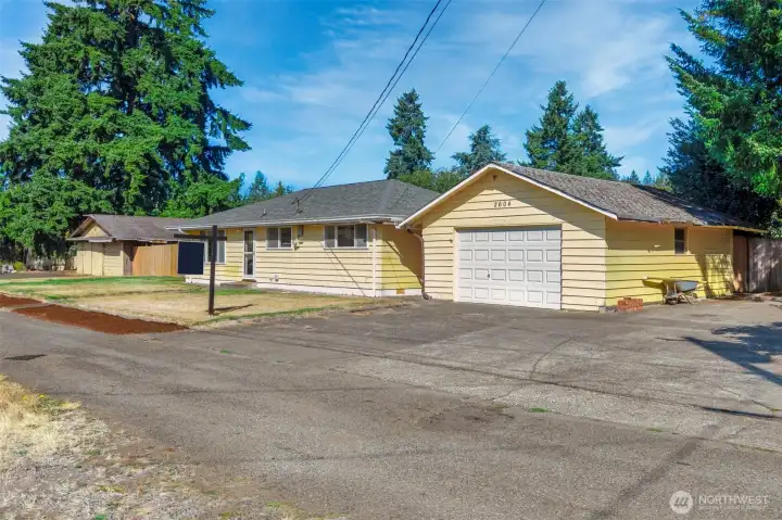 Two detached Garages with RV parking and more!