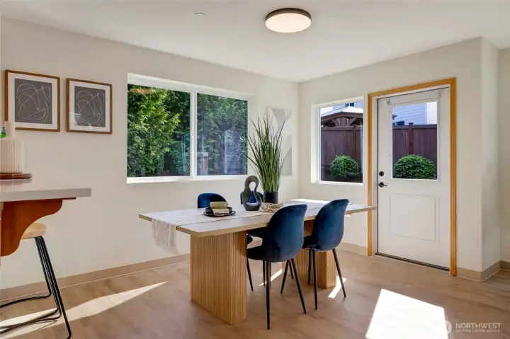 Large Eat-in kitchen area with door leading to back yard