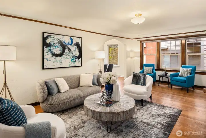 Welcome to Queen's Court, a well-maintained 1930-built condo building positioned on a quiet, tree-lined street one block from Climate Pledge Arena and Seattle Center in the heart of Lower Queen Anne.