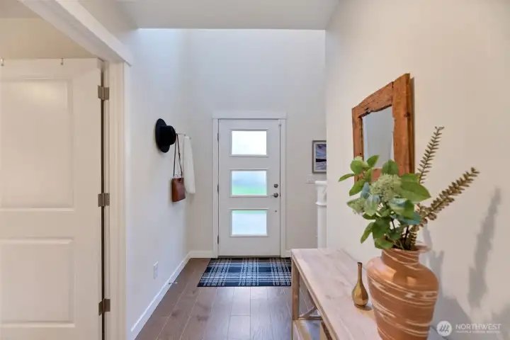 Leveled and inviting main entry with high ceiling and spacious foyer