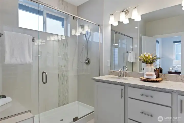 Oversized shower with operable window and sitting area