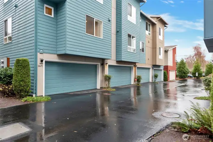 Corner unit with 2 car attached garage from dead-end back alley, ease access from street parking.