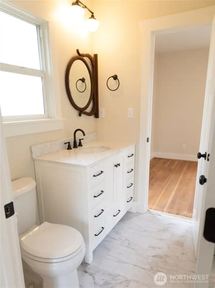 Convenient quarter bathroom on main level