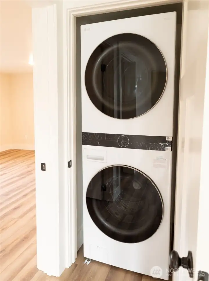 Brand-new stackable washer and dryer add modern convenience while maximizing space with a clean, efficient design.