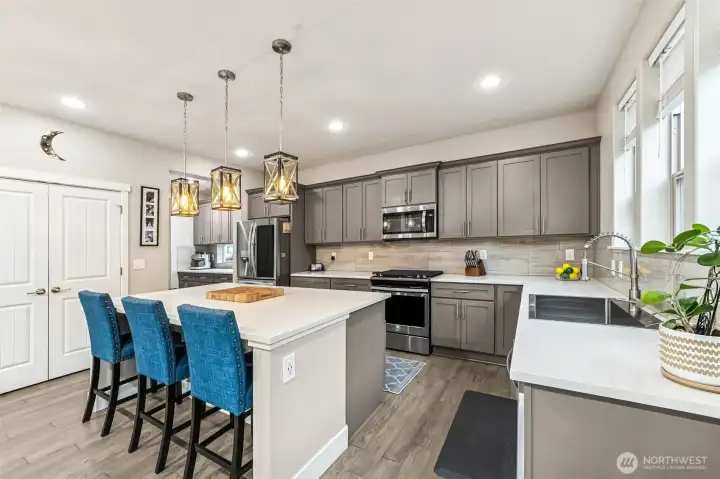Another view of the kitchen with double door pantry