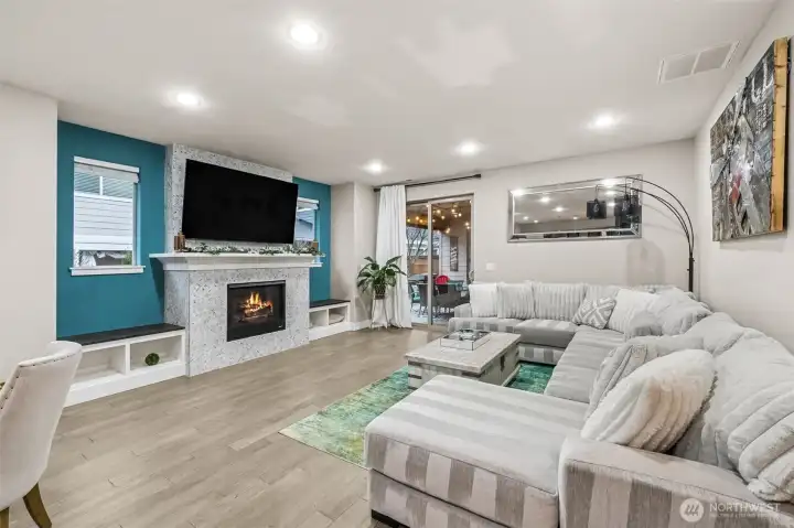 Gorgeous gas fireplace with mosaic tiles and built ins.