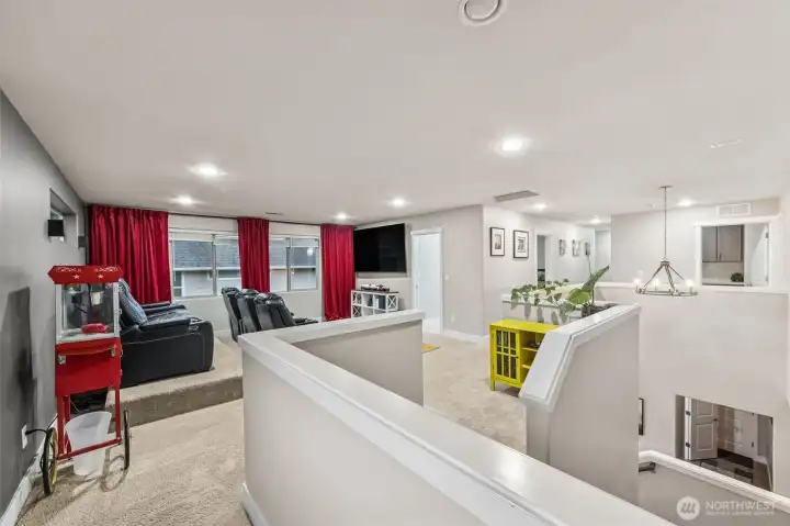 Loft area set up as a movie room at the top of the stairs