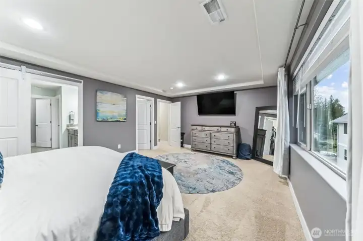 Another view of the Primary with one of the two walk in closets and bath in view