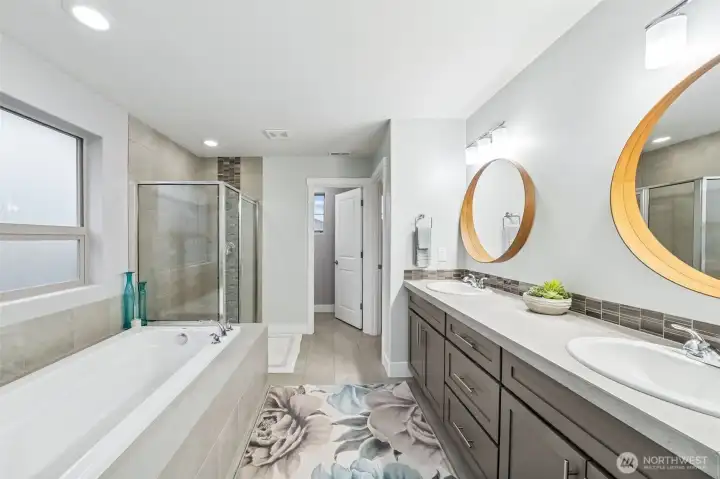 Primary bath with extra long tub, double sinks & large shower