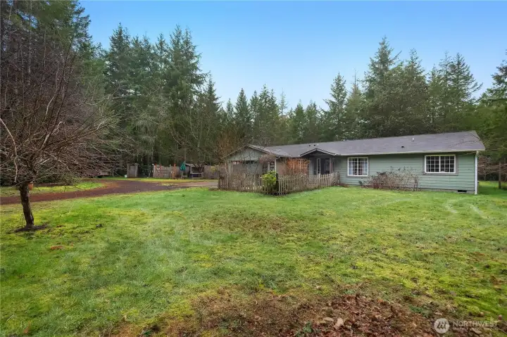 Charming 1,700 sq ft one-story home surrounded by mature landscaping.   Garden space | apple, cherry, pear and plum trees.