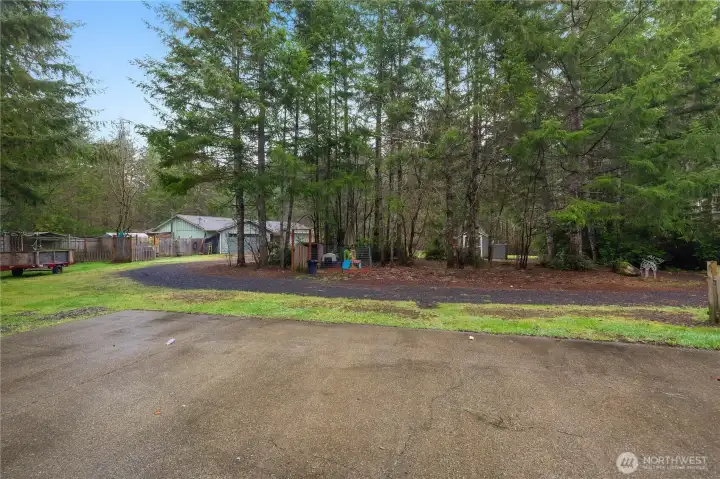 View from shop towards one-story home.