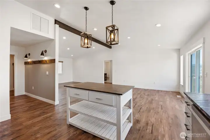 Drop zone to the left of the kitchen, coming in from garage