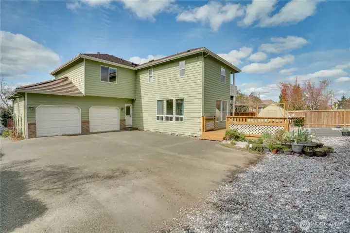 Back of the house flat pad 2-car attached garage and additional parking