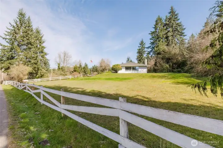 White board fence frames the setting for this lovely close-in mini-farm!