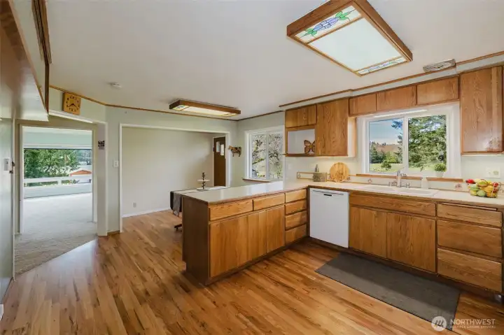 Fully equipped kitchen with oak cabinets.