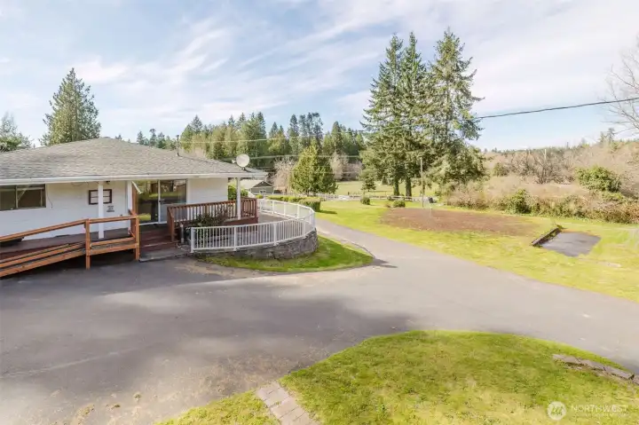 Drip water system on covered porch for hanging plants.