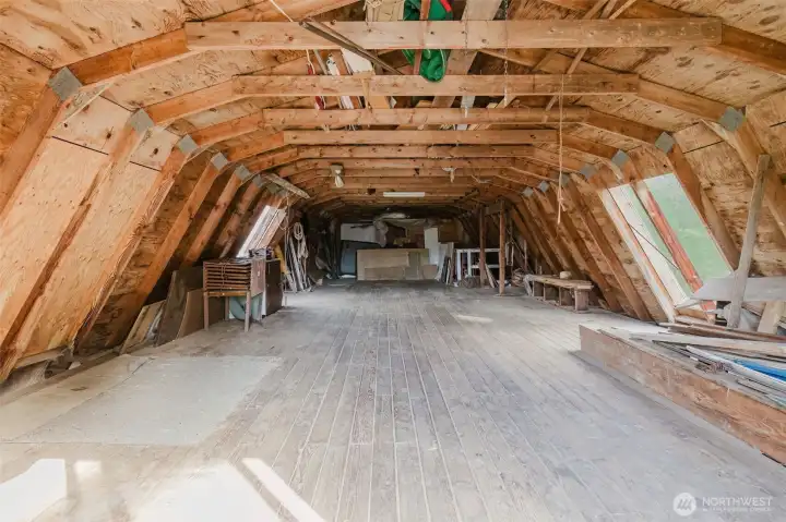 Huge hay storage area above garage/workshop with Tongue & Groove flooring.
