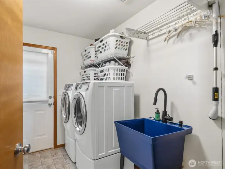 Utility with drop down folding table and storage cabinet