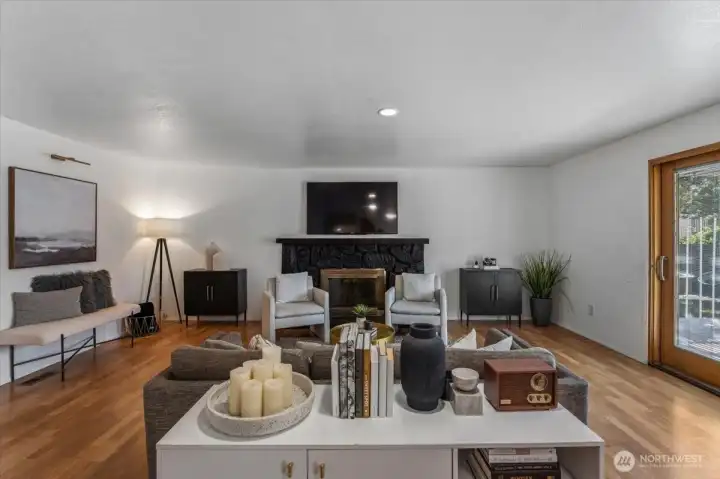 Living space for relaxing or entertaining with cozy fireplace.