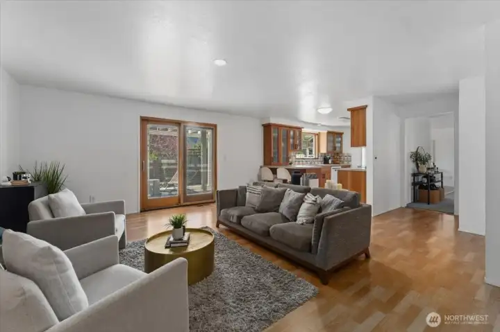 Living space with sliding door access to backyard patio.