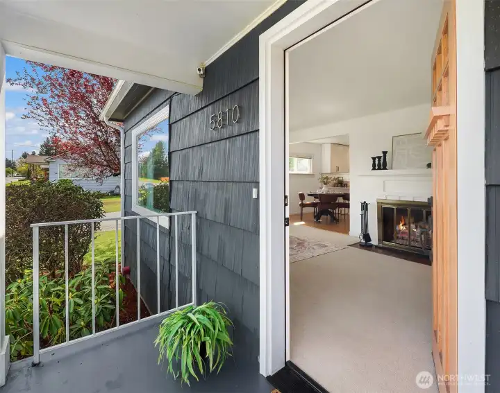 Entry opens to living room with seamless flow.