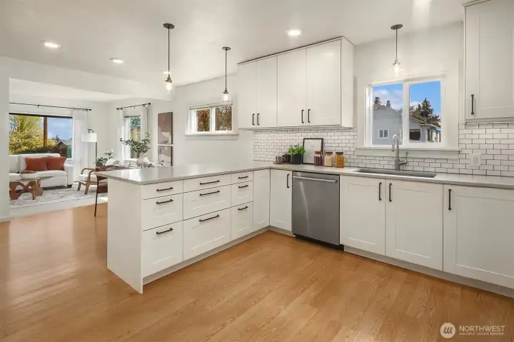 Remodeled kitchen with large island that opens to main living space.