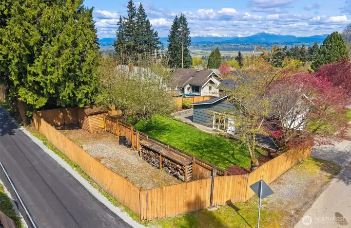 Additional gated parking space ideal for RV, boat, or extra vehicles adjacent to backyard.