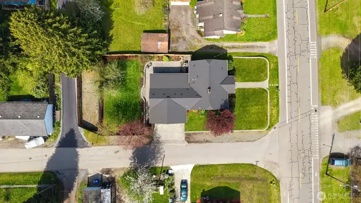 Top down view of lot showcasing ample off street parking, spacious back yard, and additional RV parking.