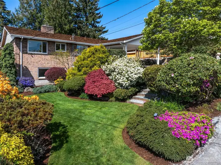Stunning brick exterior and picturesque landscaping