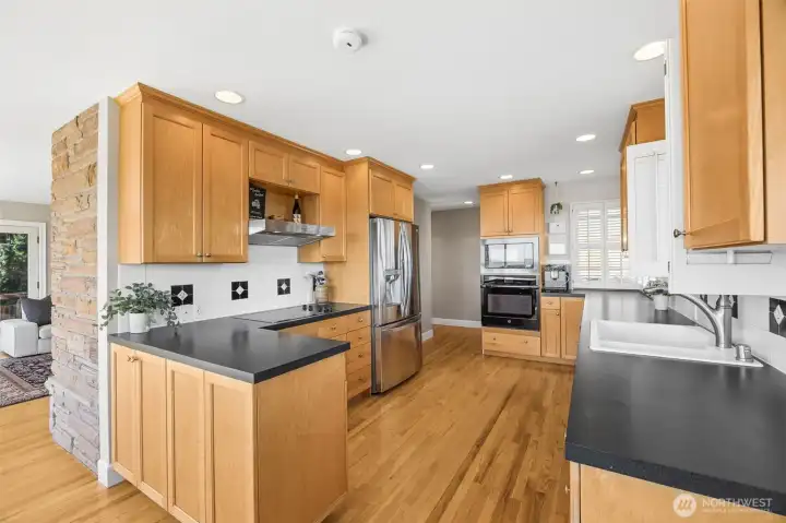 Generous sized kitchen with beautiful hardwood floors
