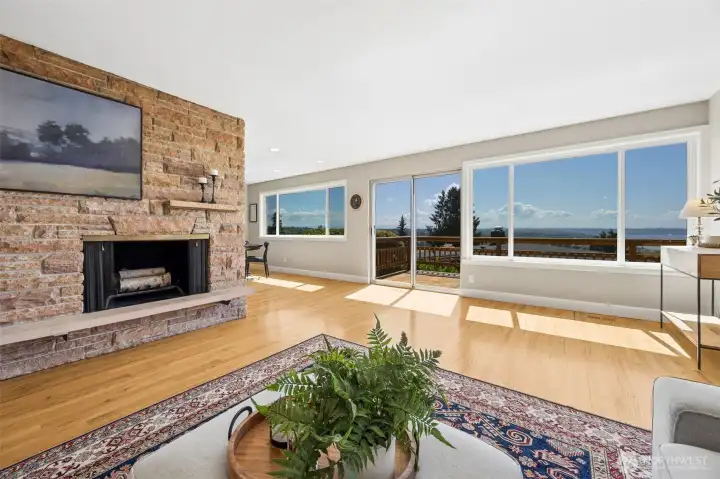 Main level living room with cozy fireplace