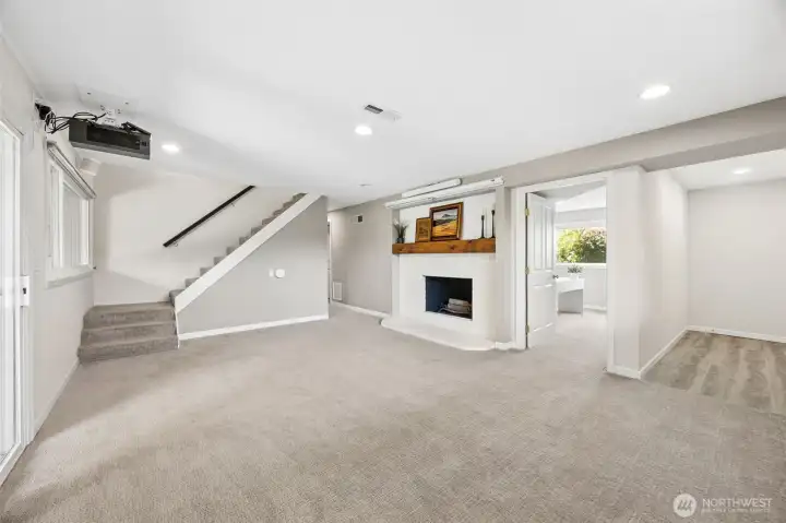 Lower level living room with exterior entrance (on right side of picture)