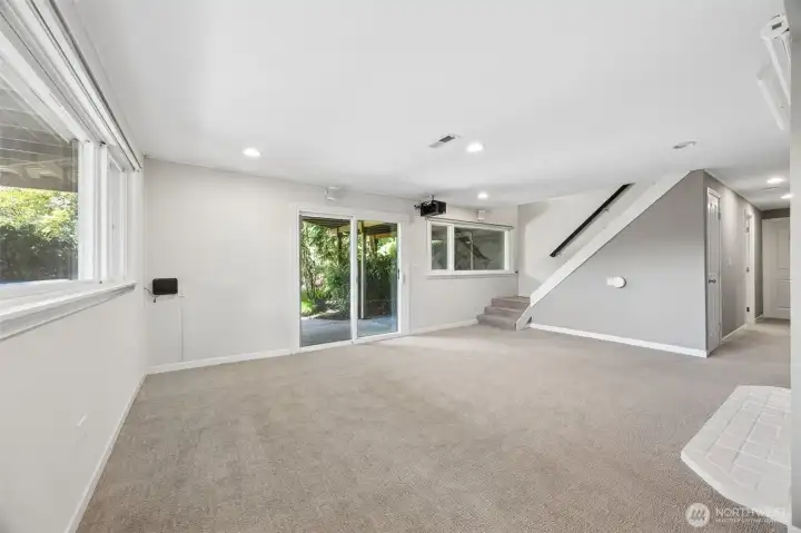 Living room with space for potential kitchenette